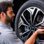 Hyundai service technician working on a wheel